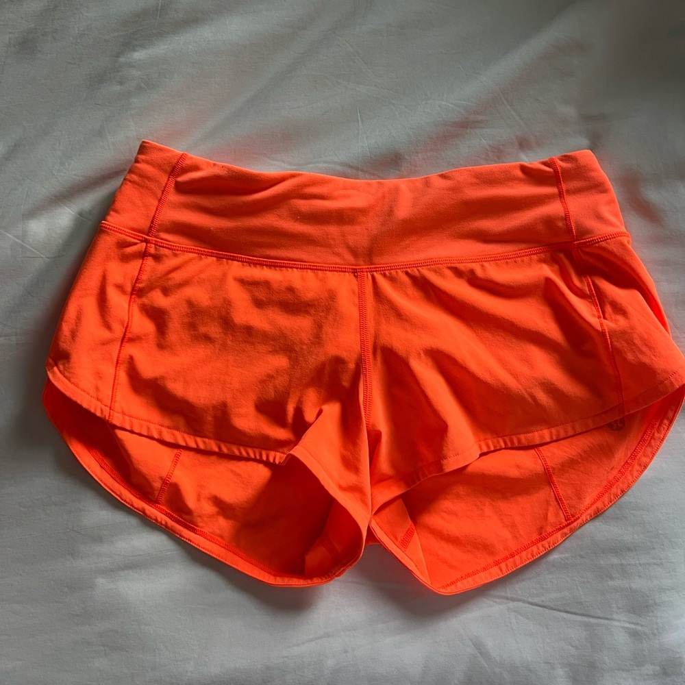LULULEMON speed up shorts. rare neon orange.